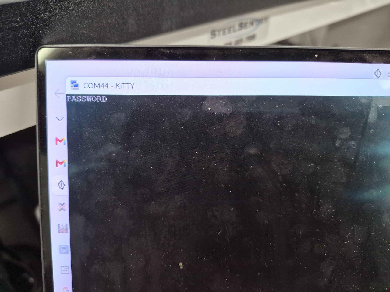 A PuTTY terminal window labelled COM44 showing the word PASSWORD as the dumped admin password.